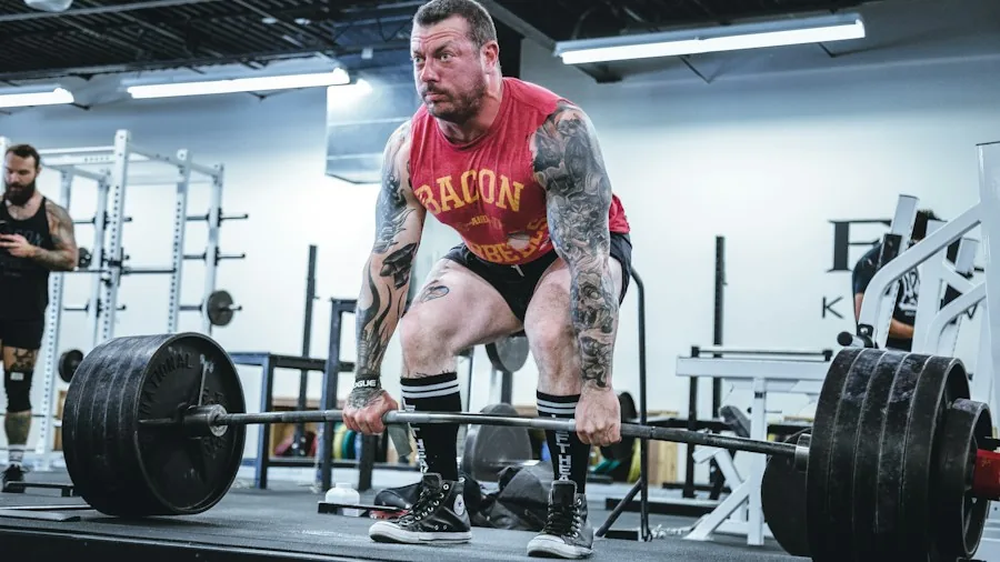 athlete gripping weight during exercise