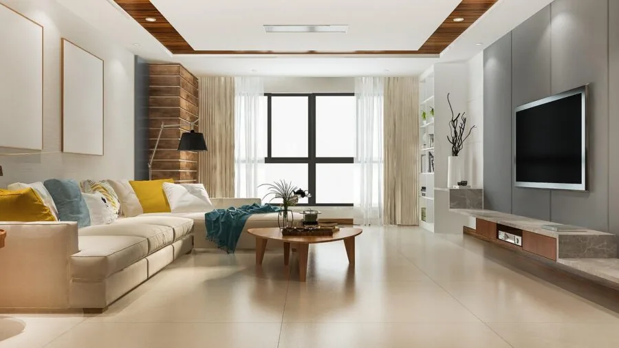 Bright, open-plan living room in a large home with natural light streaming through windows