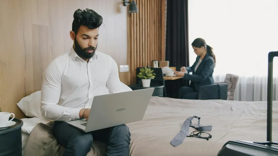 business traveler working laptop on desk