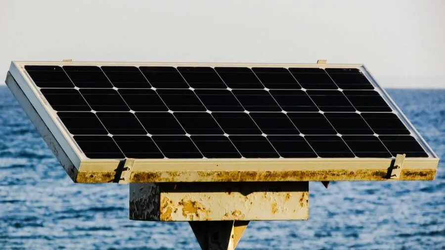 Camping setup with solar panels in natural sunlight during daytime outdoor adventure