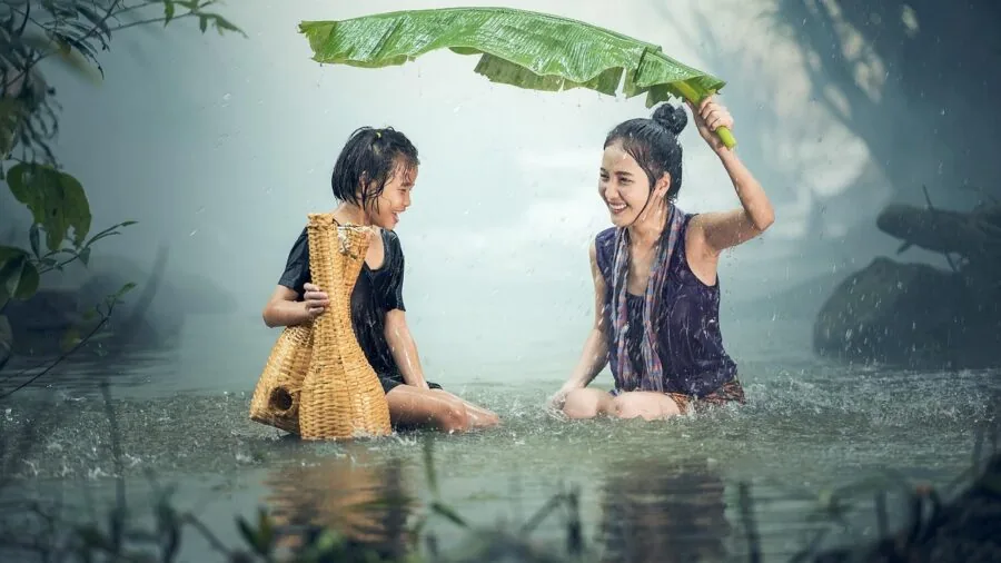 Child enjoying outdoor creative photography activity without digital screens, focused on analog play