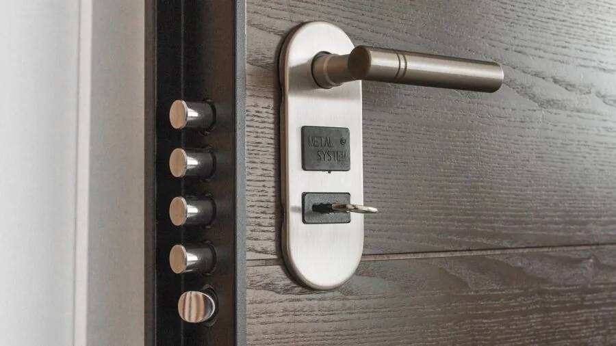 Close-up of a residential front door deadbolt lock on a home entrance