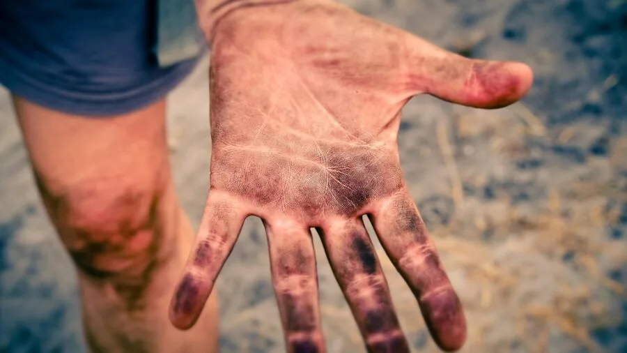 Close-up of hands holding a game controller during an intense gaming session
