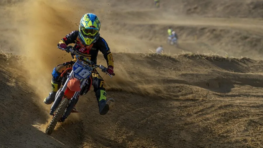 Close-up of motorcycle engine vibrating during ride, showing motion blur and mechanical intensity