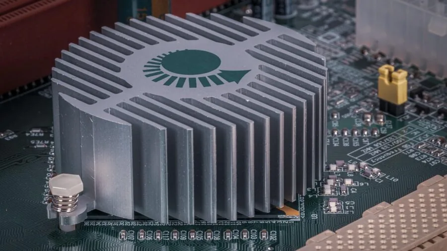 Close-up of PC cooling fan with heat sink dissipating warm air during intensive computing session