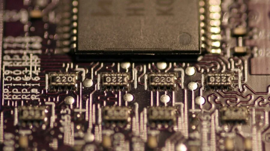 Close-up of PC cooling fans with blue LED lights showing airflow and heat dissipation in action