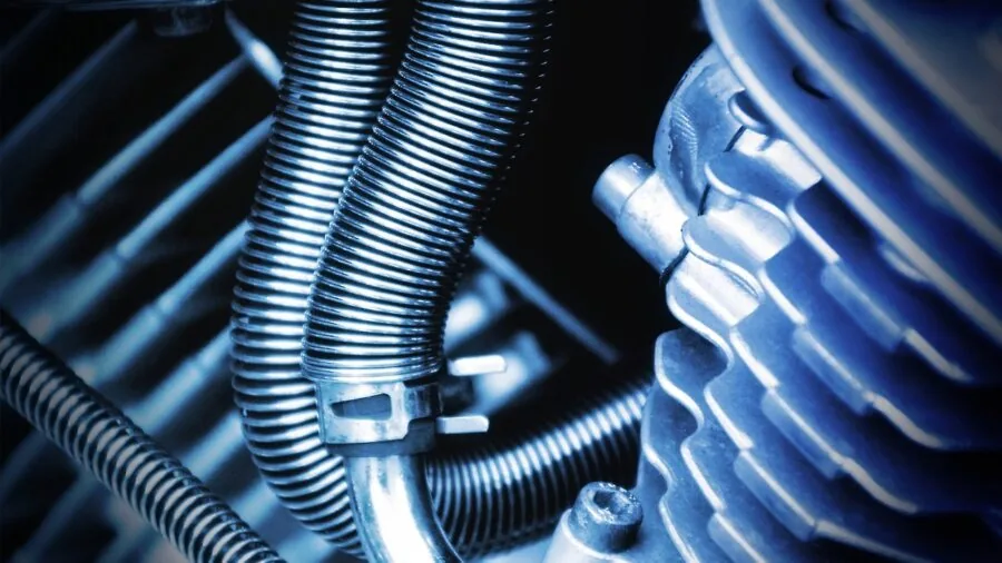 Close-up of someone inspecting gaming chair frame and base materials for quality and durability assessment