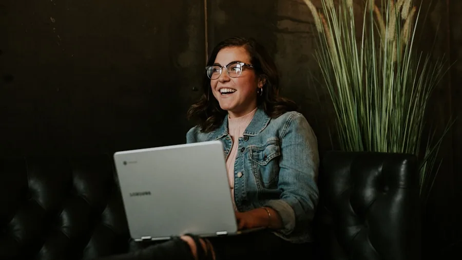 College student working on affordable laptop at desk with notebooks and coffee