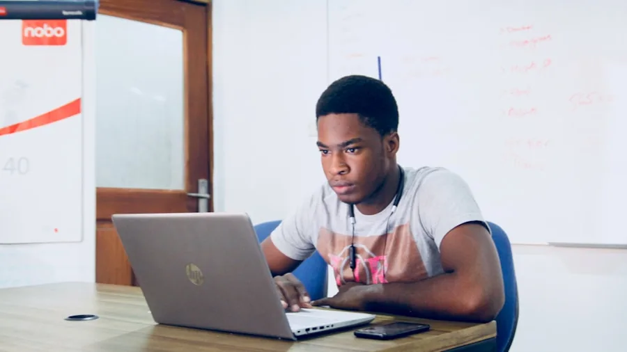 College student working on laptop with multiple tabs and applications open during study session