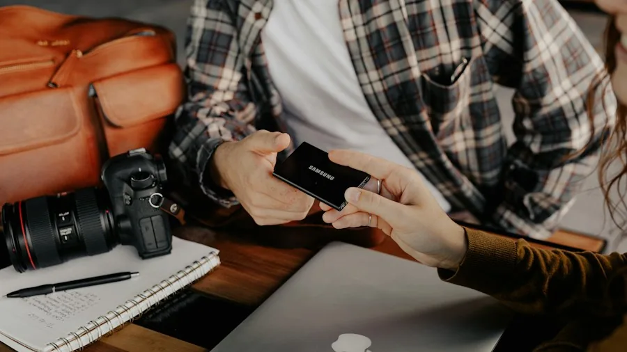 compact solid state drive next to phone