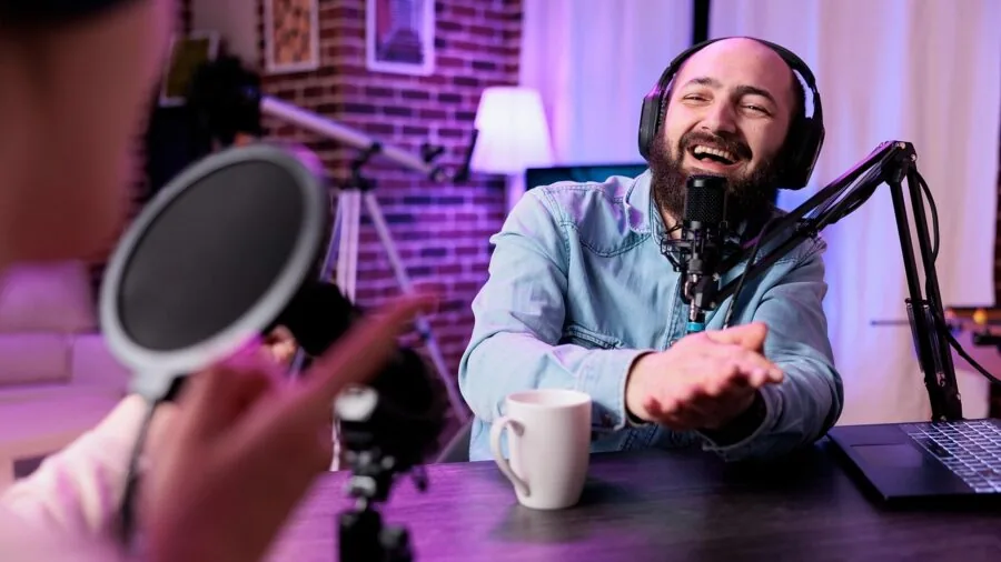 Content creator filming video on camera outdoors in natural daylight