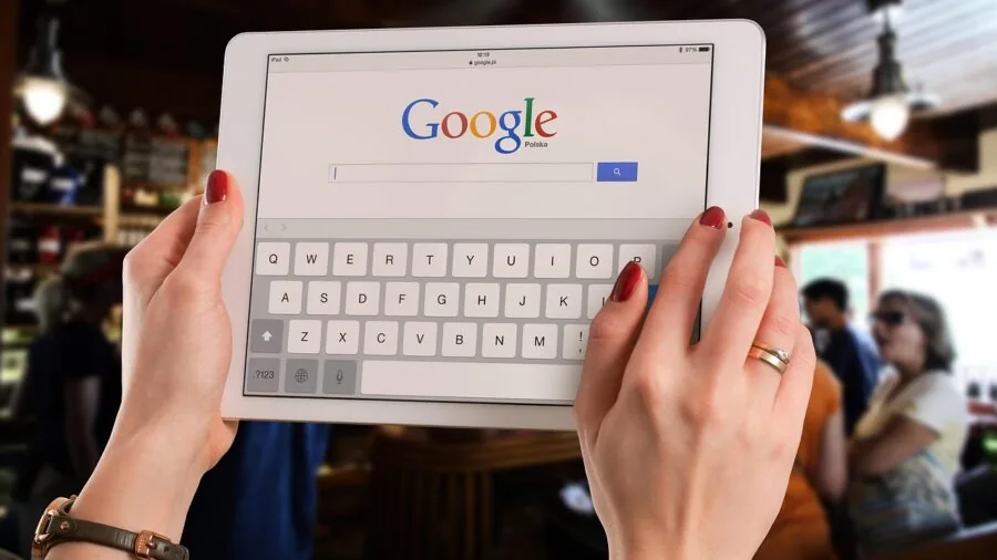 Creative professional using pen tablet while viewing monitor display during digital art workflow