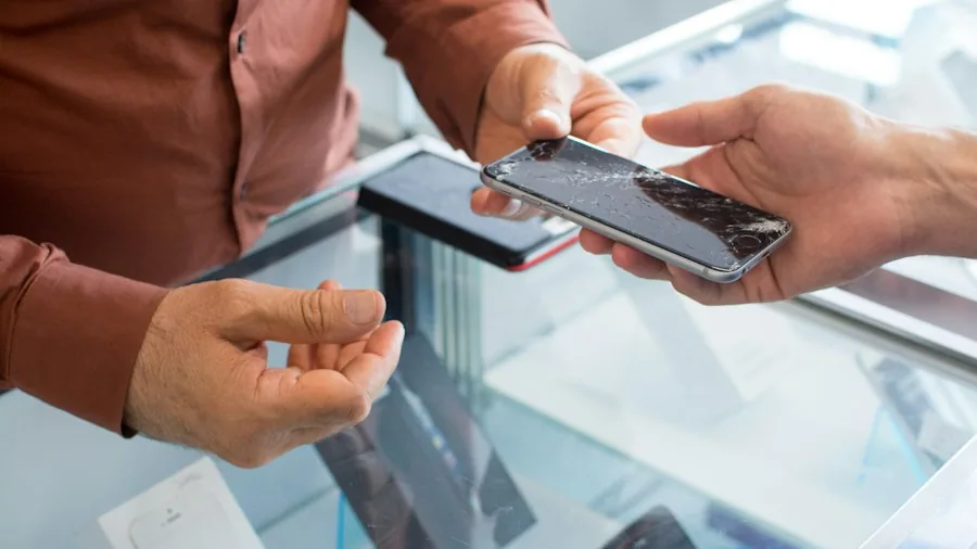 customer examining smartphone specifications