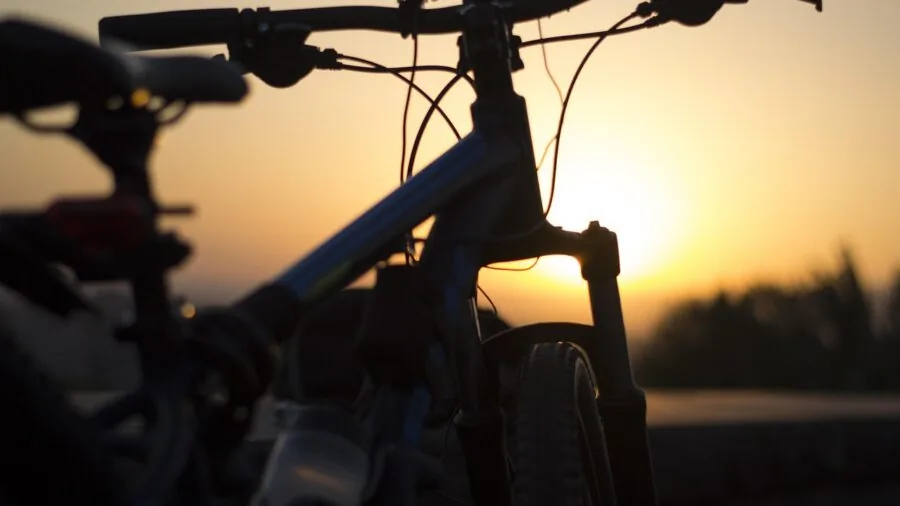 Cyclist riding on scenic outdoor trail during daytime with natural landscape background