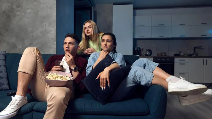 Family enjoying an immersive movie experience together in a modern living room with quality sound system
