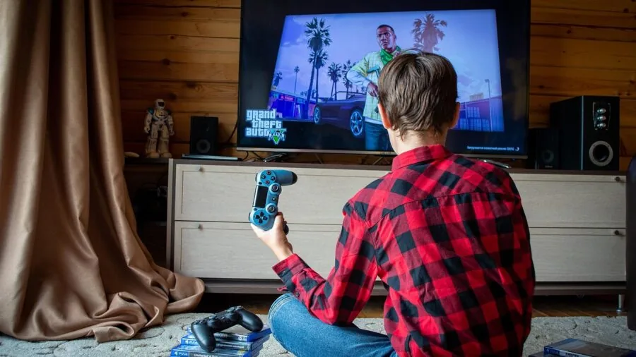 Family enjoying gaming together on living room console setup with comfortable seating