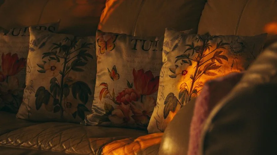 Family enjoying time together in a comfortable living room during evening, demonstrating smart home entertainment lifestyle