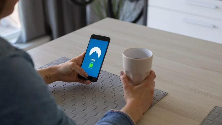 Family in living room using multiple devices with strong home wifi connection for streaming entertainment