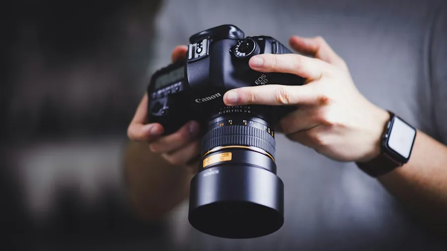 filmmaker adjusting camera settings