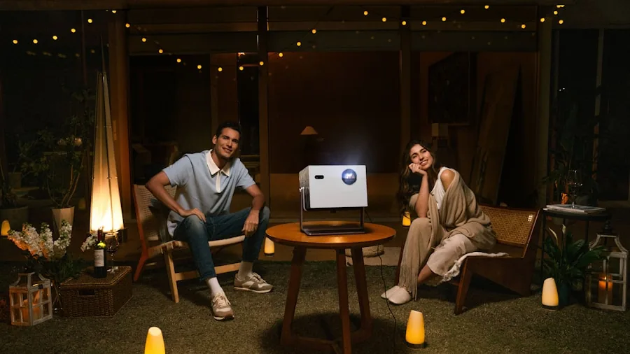 Friends gathered around a projector screen outdoors at night enjoying entertainment under the stars