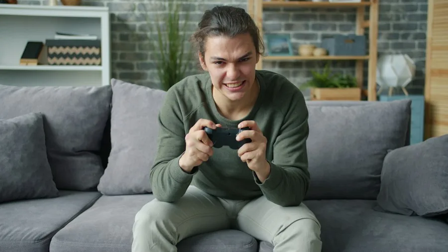 gamer holding controller at home