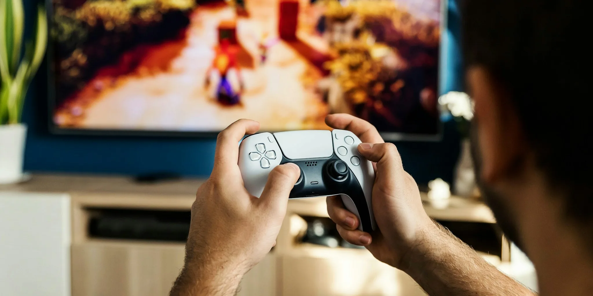 gamer playing action game controller