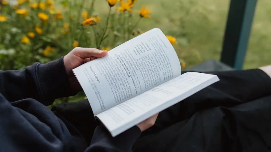 hands holding book reading title