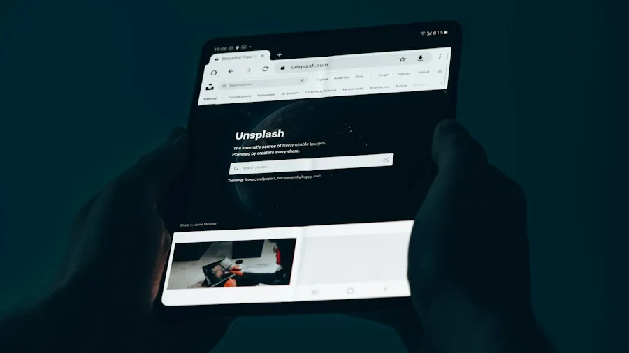 hands holding foldable phone rotating screen