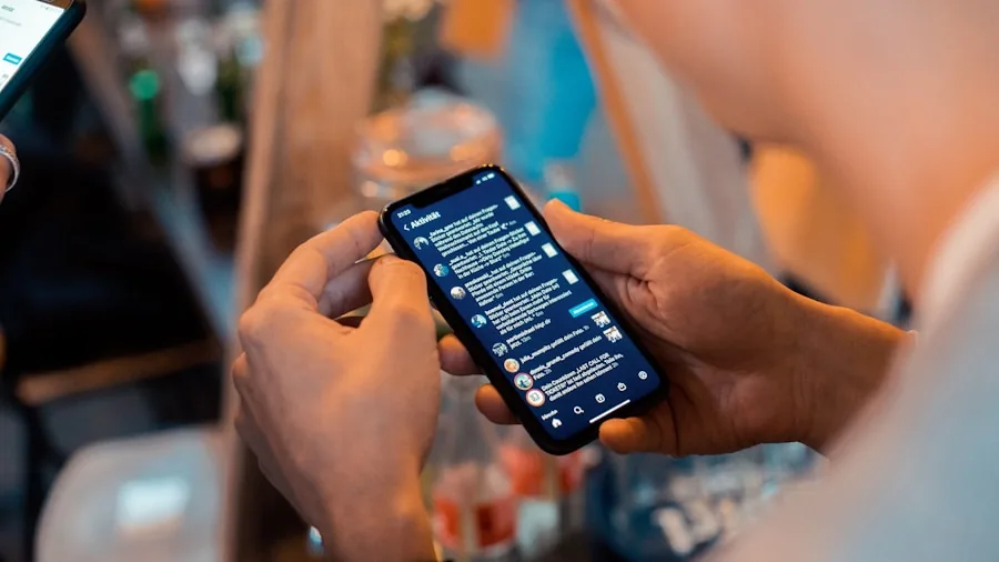 hands holding smartphone translating text