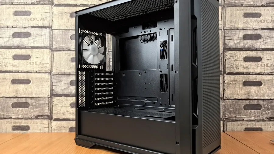 Interior view of open PC case showing component layout and mounting space for power supply installation