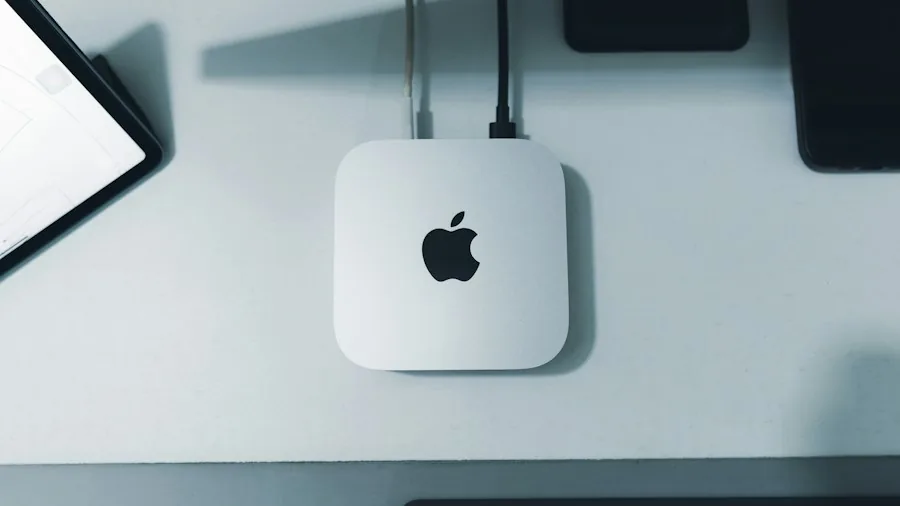 Mac Mini on desk with cables and peripherals