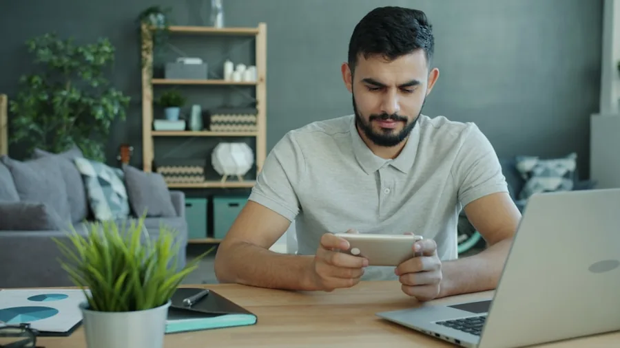 man organizing mobile devices