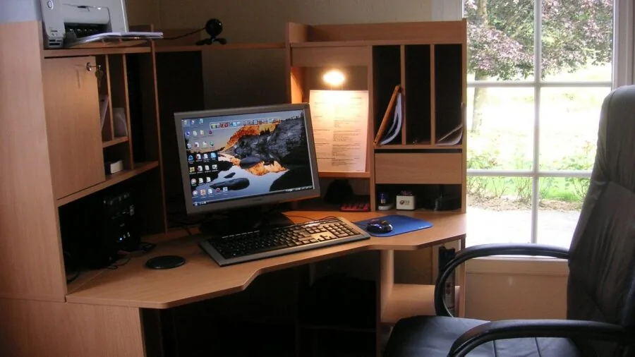 Modern home office desk with compact printer fitting neatly into small workspace