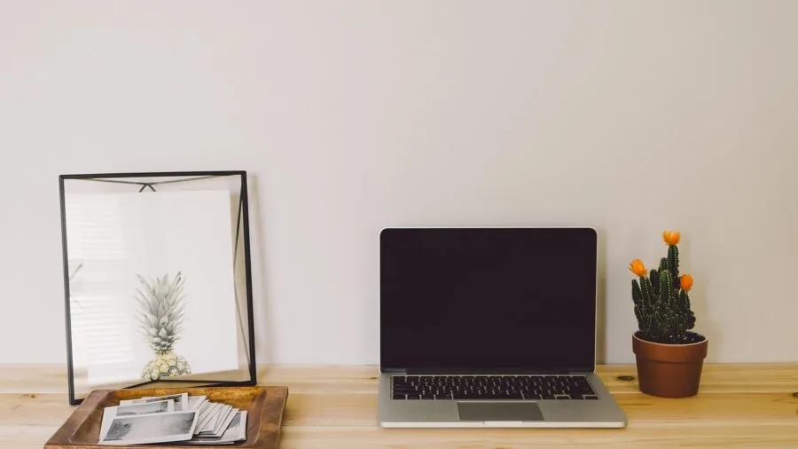 Modern home office desk with wireless router and computer setup for internet connectivity