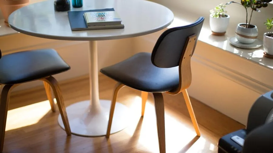 Modern home office with concrete walls, furniture, and multiple levels showing real-world interior obstacles