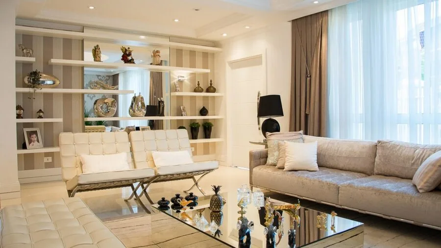 Modern living room with comfortable seating and entertainment system displaying home theater setup