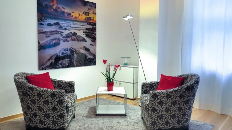 Modern living room with comfortable seating arranged for optimal audio experience and sound quality