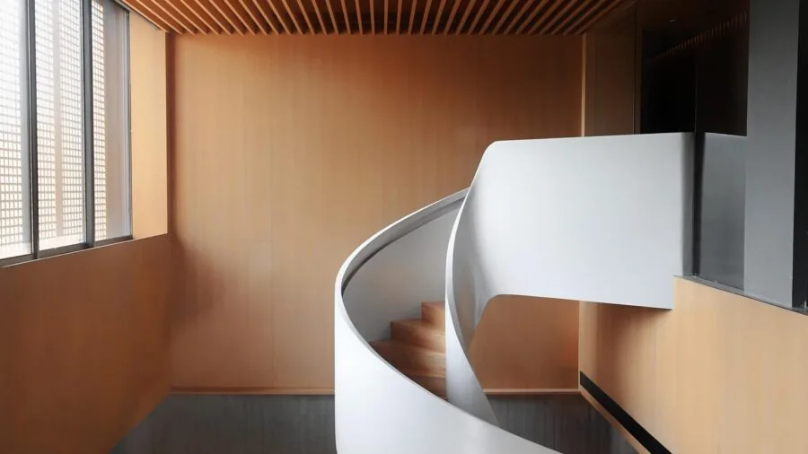 Modern living room with speakers positioned on dedicated stands for optimal sound quality and room acoustics