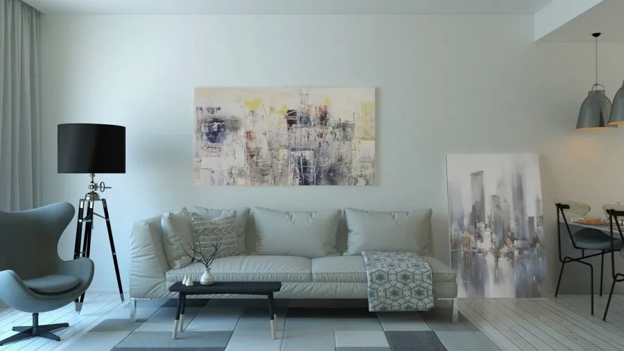 Modern living room with speakers strategically positioned away from bookshelves for optimal sound quality