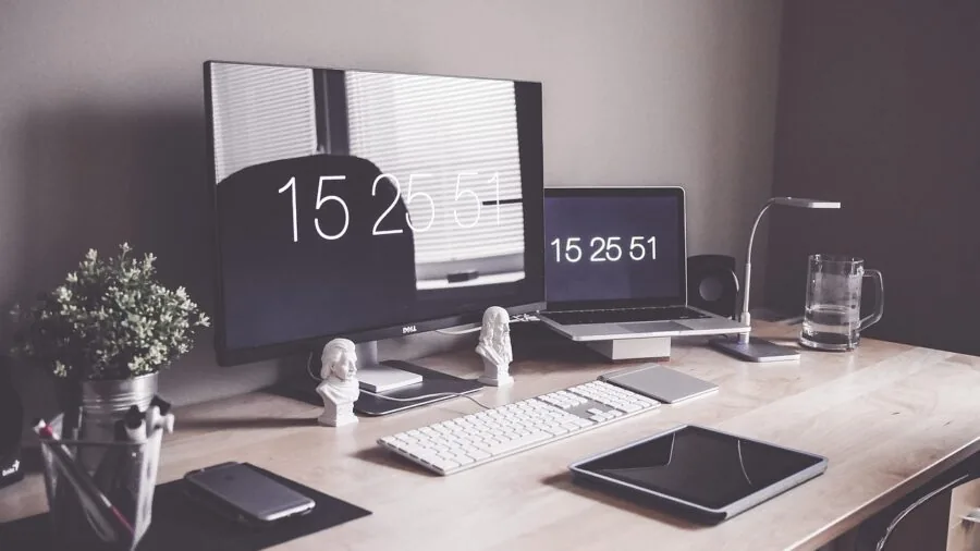 Modern workspace with desktop PC showing cooling vents and air circulation around gaming computer setup