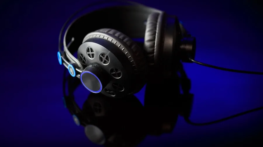 Music producer wearing headphones in professional studio recording session
