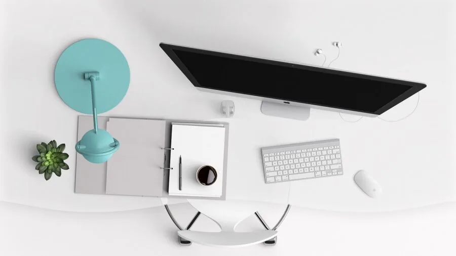 Organized desk setup with compact computer equipment and storage solutions in modern workspace