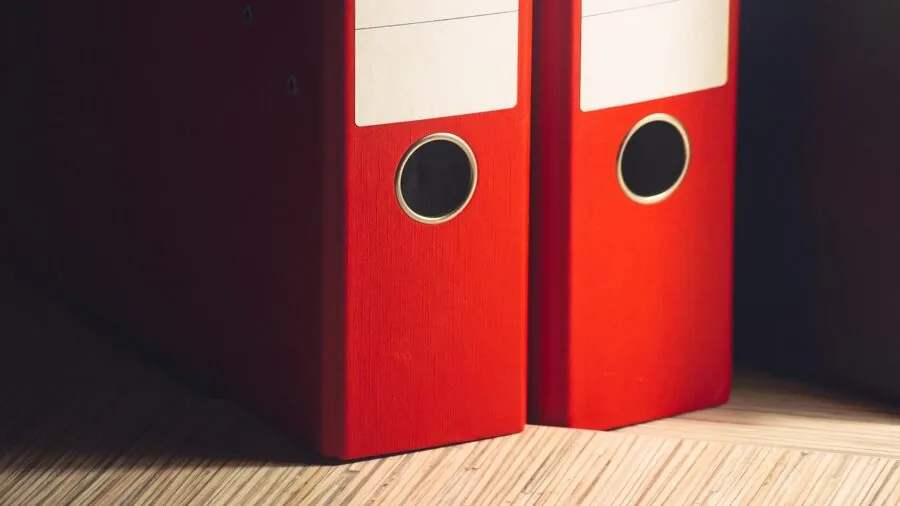 Organized workspace with documents and files stored on desk, representing digital data management and organization