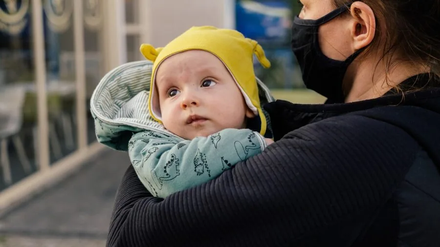 Parent checking smartphone app to monitor child's location and safety in real time