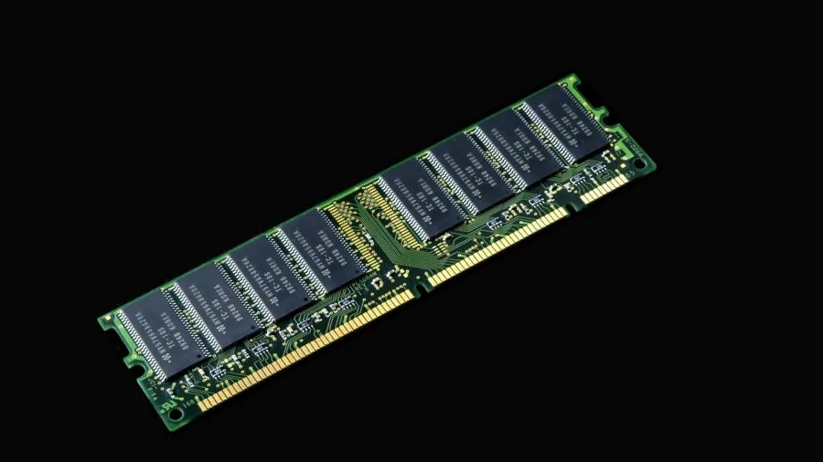 Person arranging external storage devices and memory cards on a desk for data management