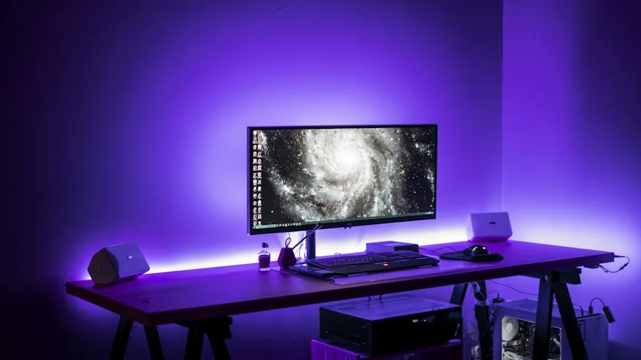 Person at gaming desk with multiple wired devices and network cables organized for optimal connectivity