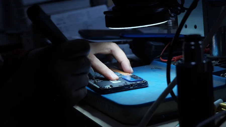 Person carefully handling and protecting a delicate electronic device with protective case