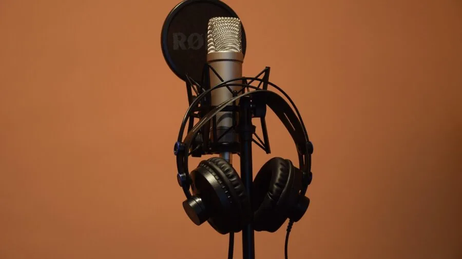 Person carefully reading technical specifications and product details while researching audio equipment purchases