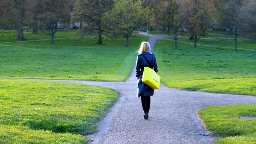 Person carefully weighing options and making a balanced decision