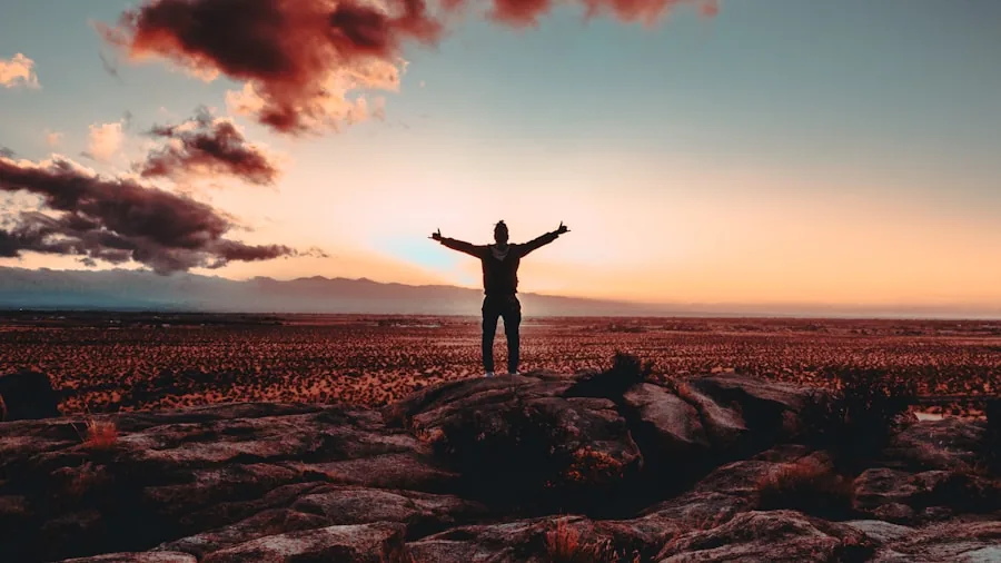 person celebrating victory arms raised